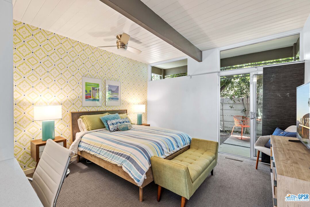 1008 Apache Road Palm Springs, CA 92264 - Photo 13 of 55 a bedroom with a bed and wooden floor