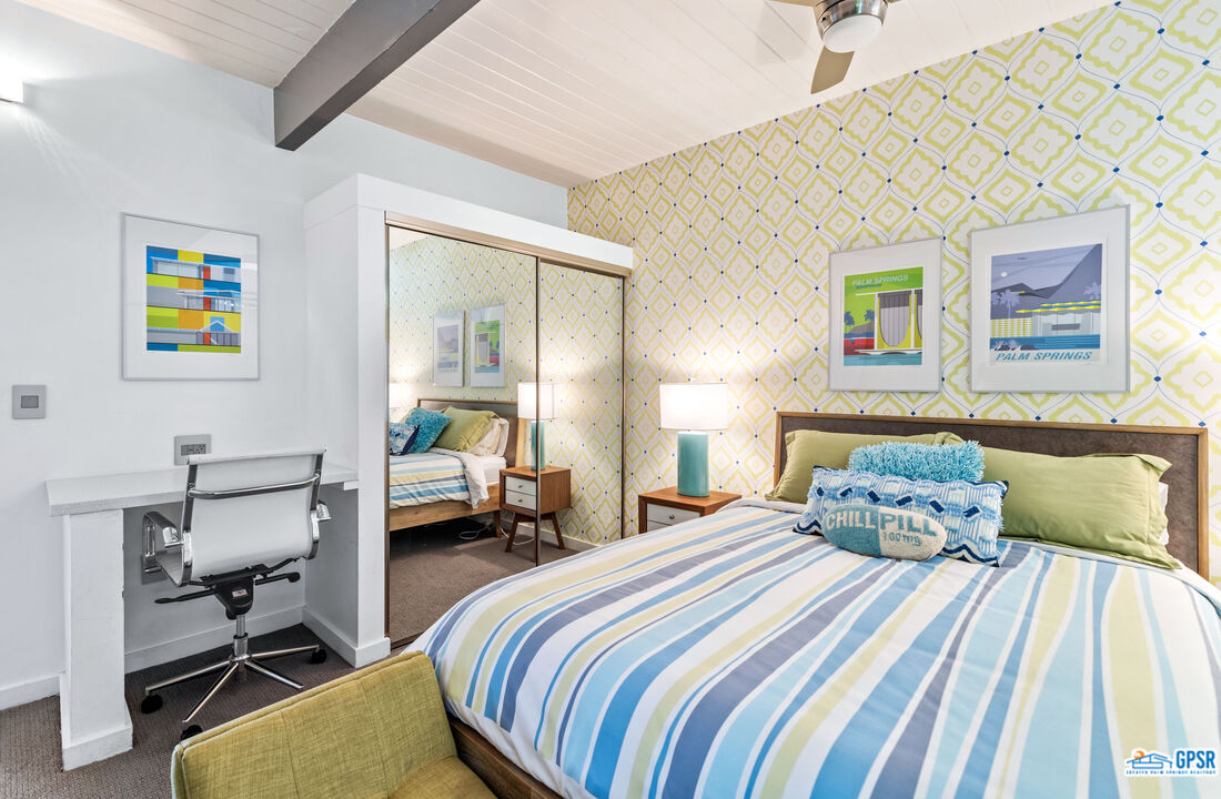 1008 Apache Road Palm Springs, CA 92264 - Photo 14 of 55 a bedroom with a bed and wooden floor