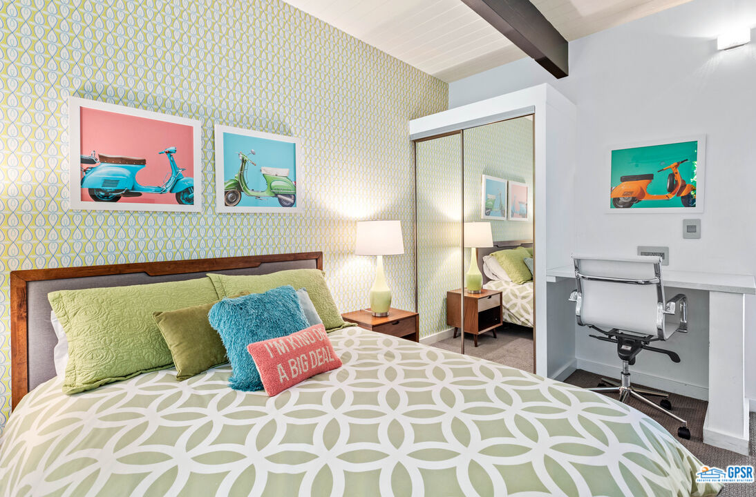 1008 Apache Road Palm Springs, CA 92264 - Photo 16 of 55 a bedroom with a bed and a couch