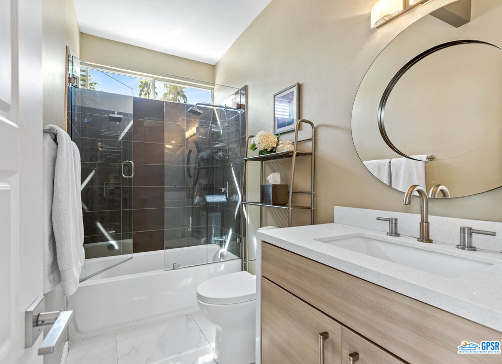 1008 Apache Road Palm Springs, CA 92264 - Photo 17 of 55 a bathroom with a sink a toilet and shower