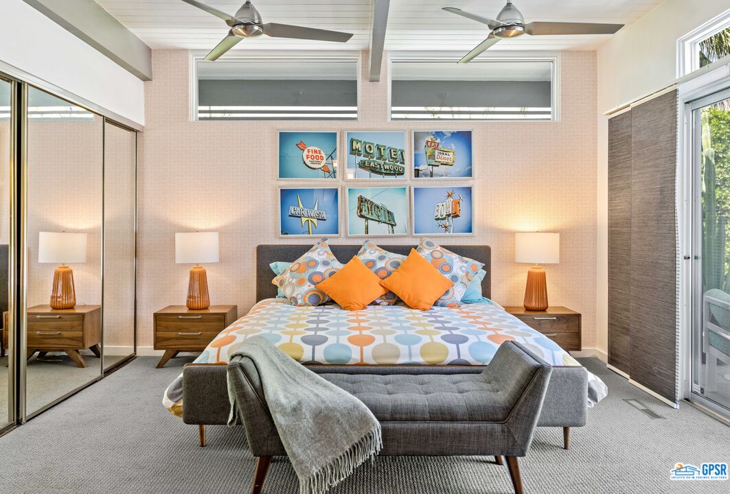 1008 Apache Road Palm Springs, CA 92264 - Photo 20 of 55 a bedroom with a bed and wooden floor