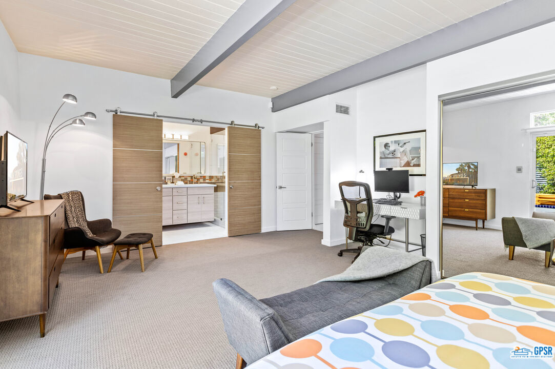 1008 Apache Road Palm Springs, CA 92264 - Photo 21 of 55 a view of a livingroom with workspace and a couch