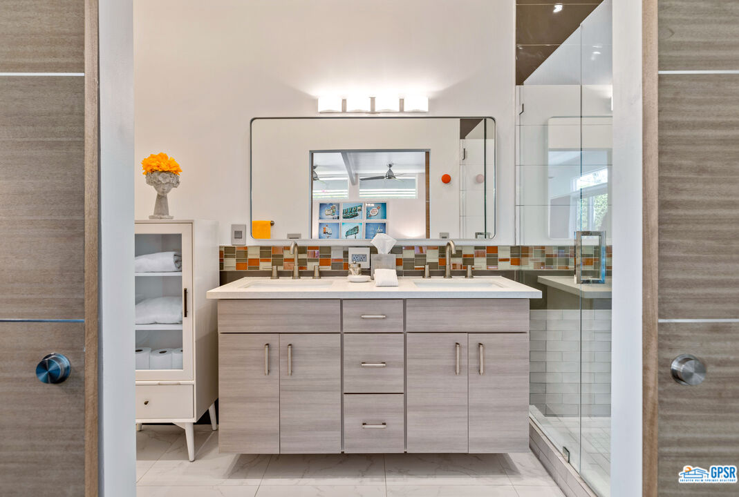 1008 Apache Road Palm Springs, CA 92264 - Photo 22 of 55 a bathroom with a sink double vanity and a mirror