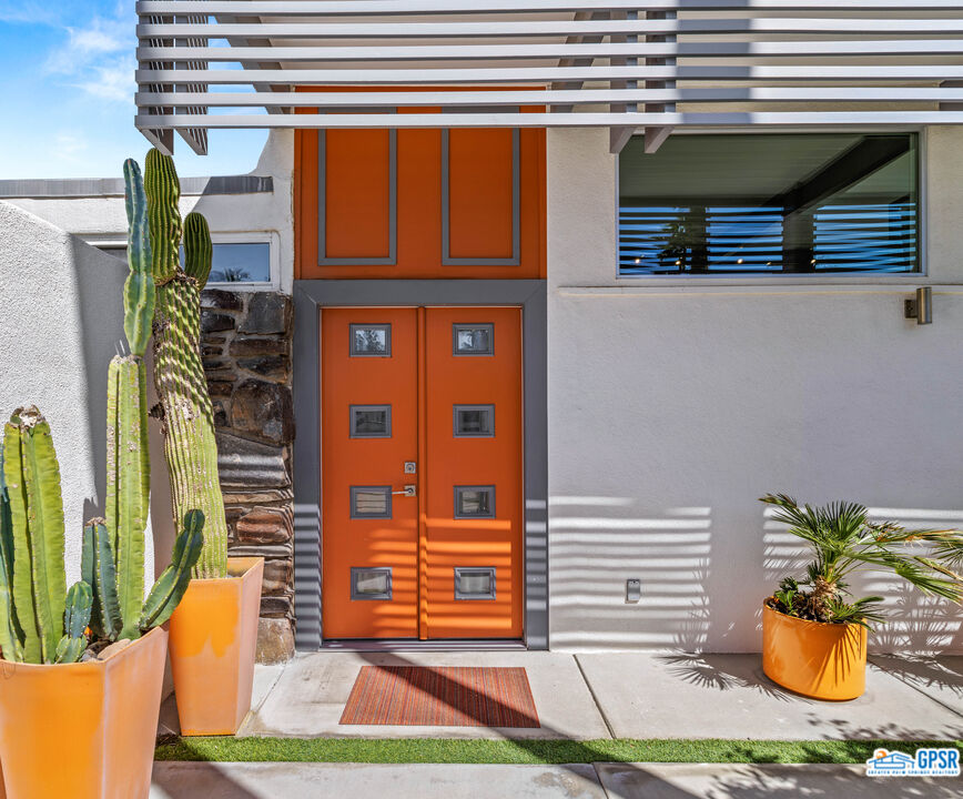 1008 Apache Road Palm Springs, CA 92264 - Photo 3 of 55 a front view of a house with a yard