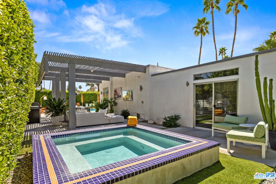 1008 Apache Road Palm Springs, CA 92264 - Photo 35 of 55 a view of swimming pool with chairs in patio