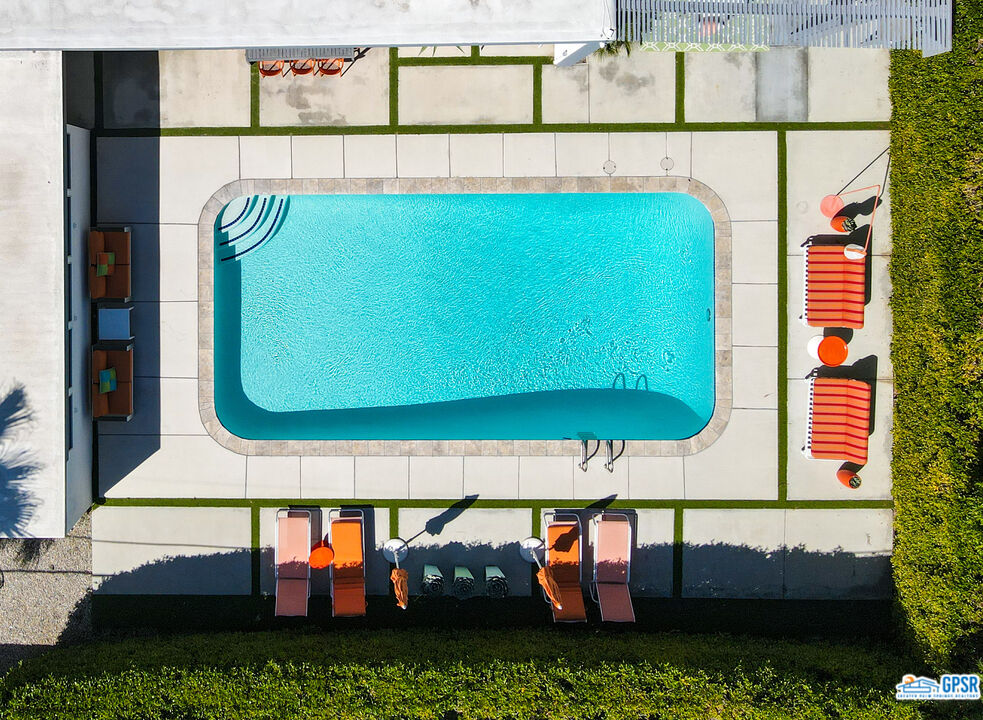 1008 Apache Road Palm Springs, CA 92264 - Photo 42 of 55 a view of swimming pool with a yard