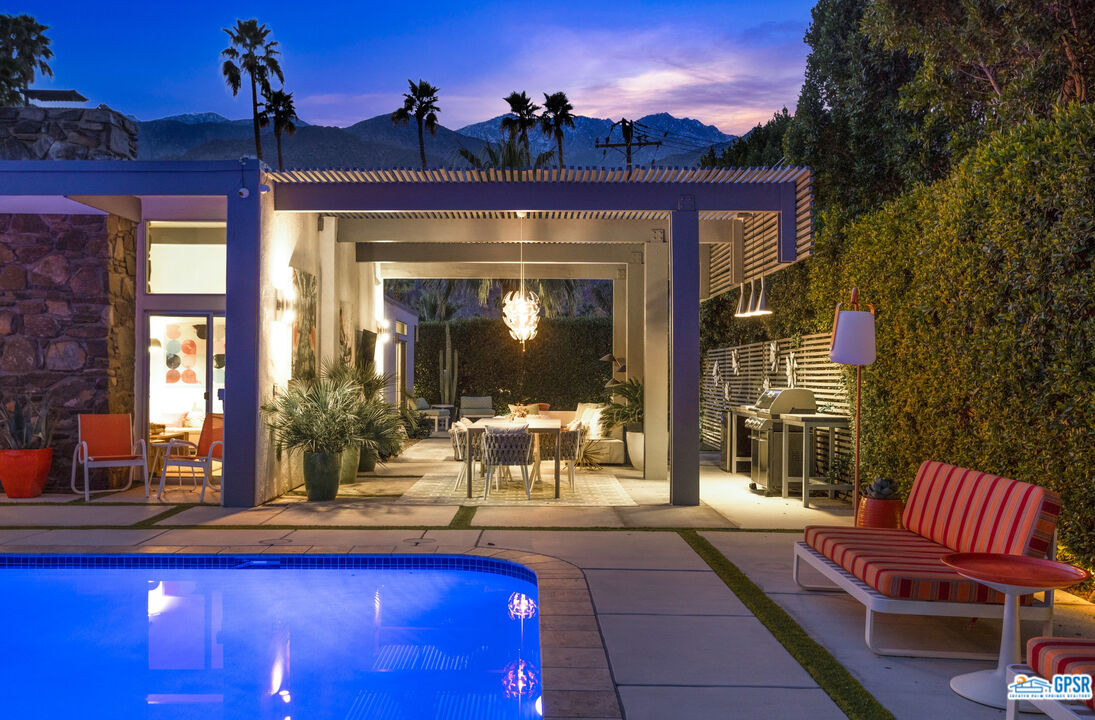 1008 Apache Road Palm Springs, CA 92264 - Photo 50 of 55 a view of a house with swimming pool and sitting area