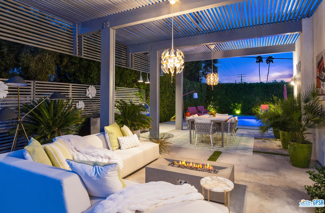 1008 Apache Road Palm Springs, CA 92264 - Photo 53 of 55 a building outdoor space with patio furniture and potted plants