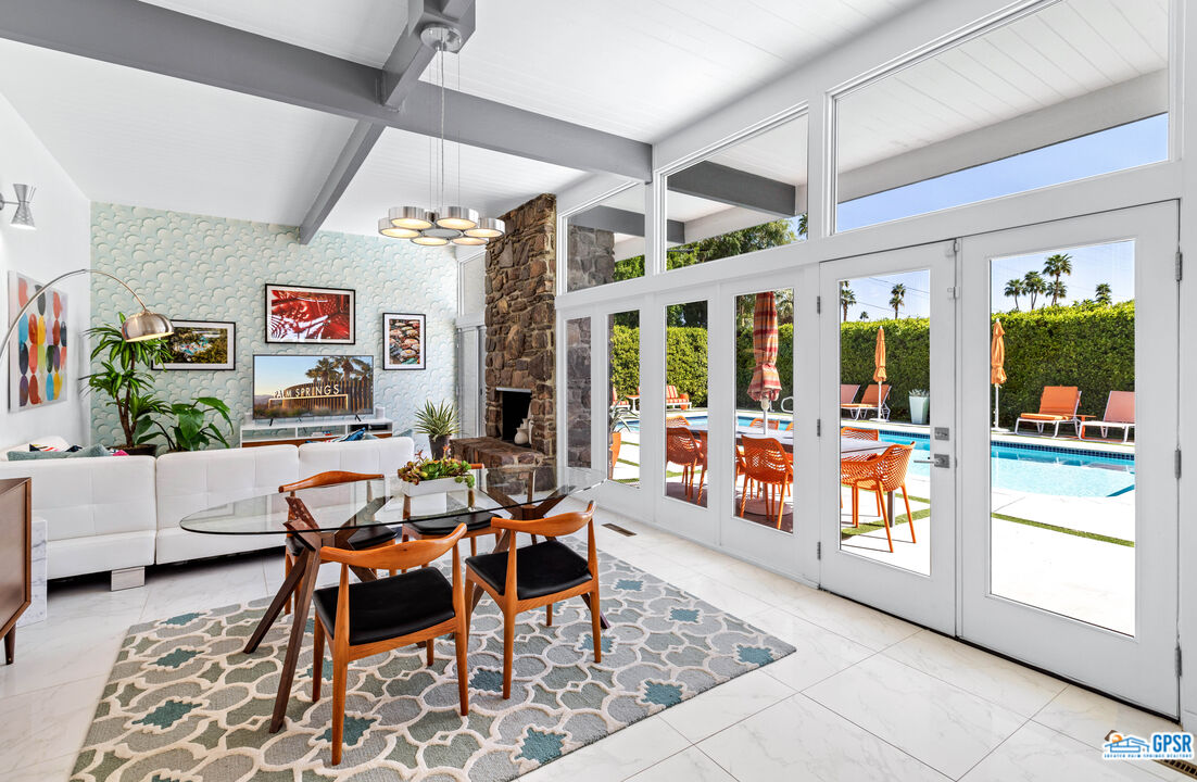 1008 Apache Road Palm Springs, CA 92264 - Photo 6 of 55 a outdoor space with lots of furniture and wooden floor