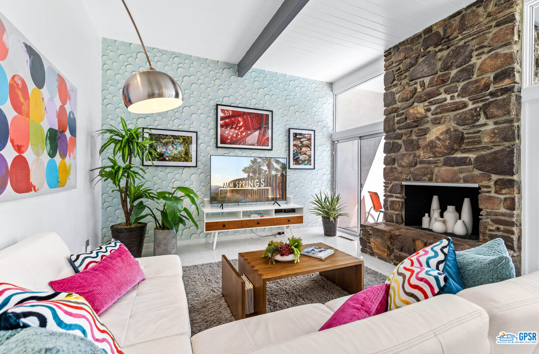 1008 Apache Road Palm Springs, CA 92264 - Photo 8 of 55 a living room with furniture and a fireplace