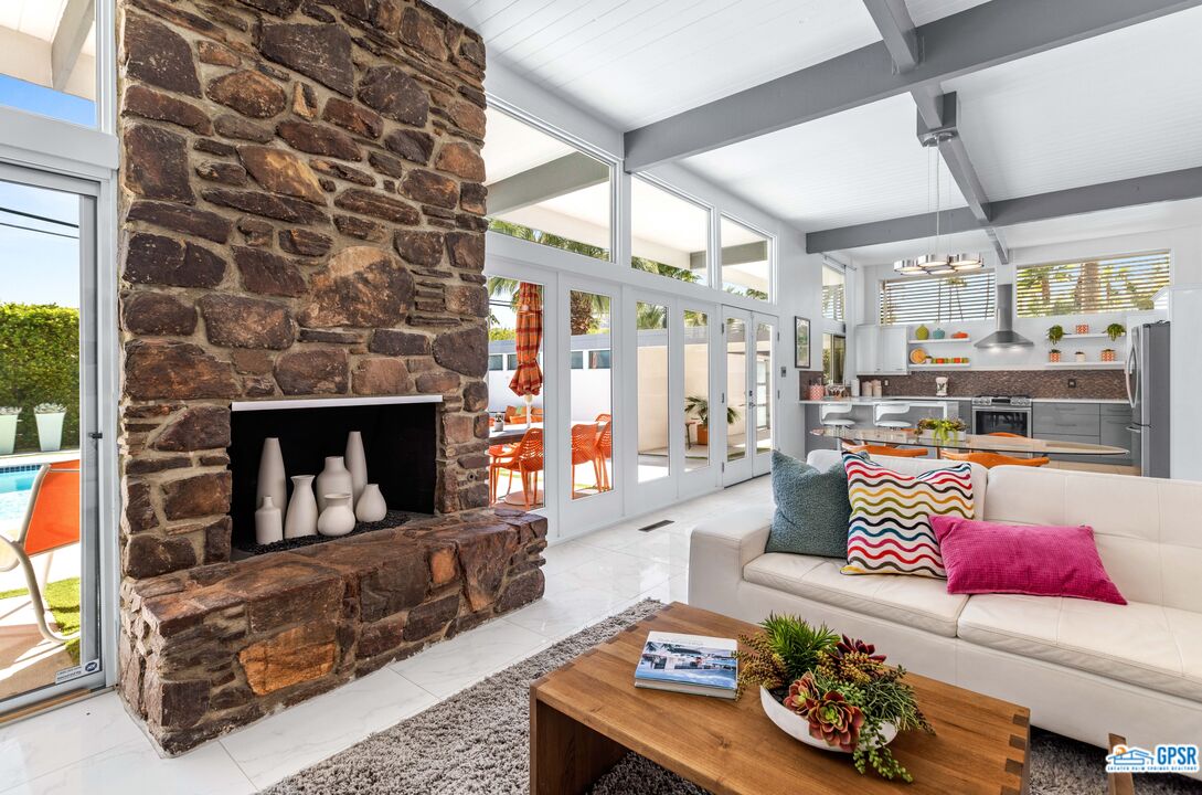1008 Apache Road Palm Springs, CA 92264 - Photo 9 of 55 a living room with furniture and a fireplace