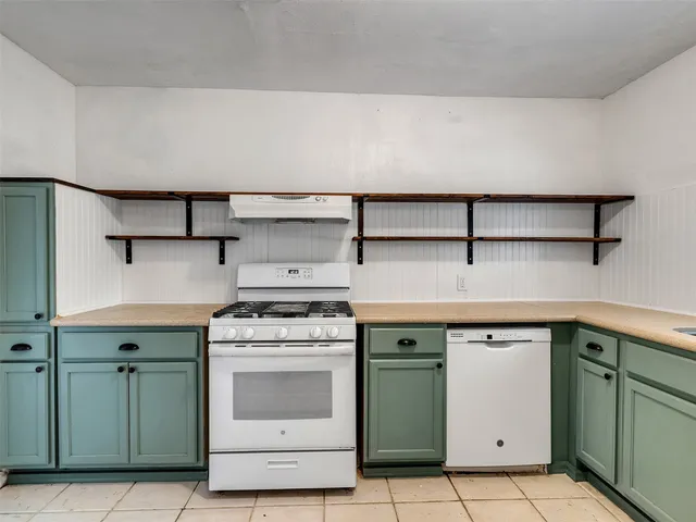 a view of a kitchen with cabinets