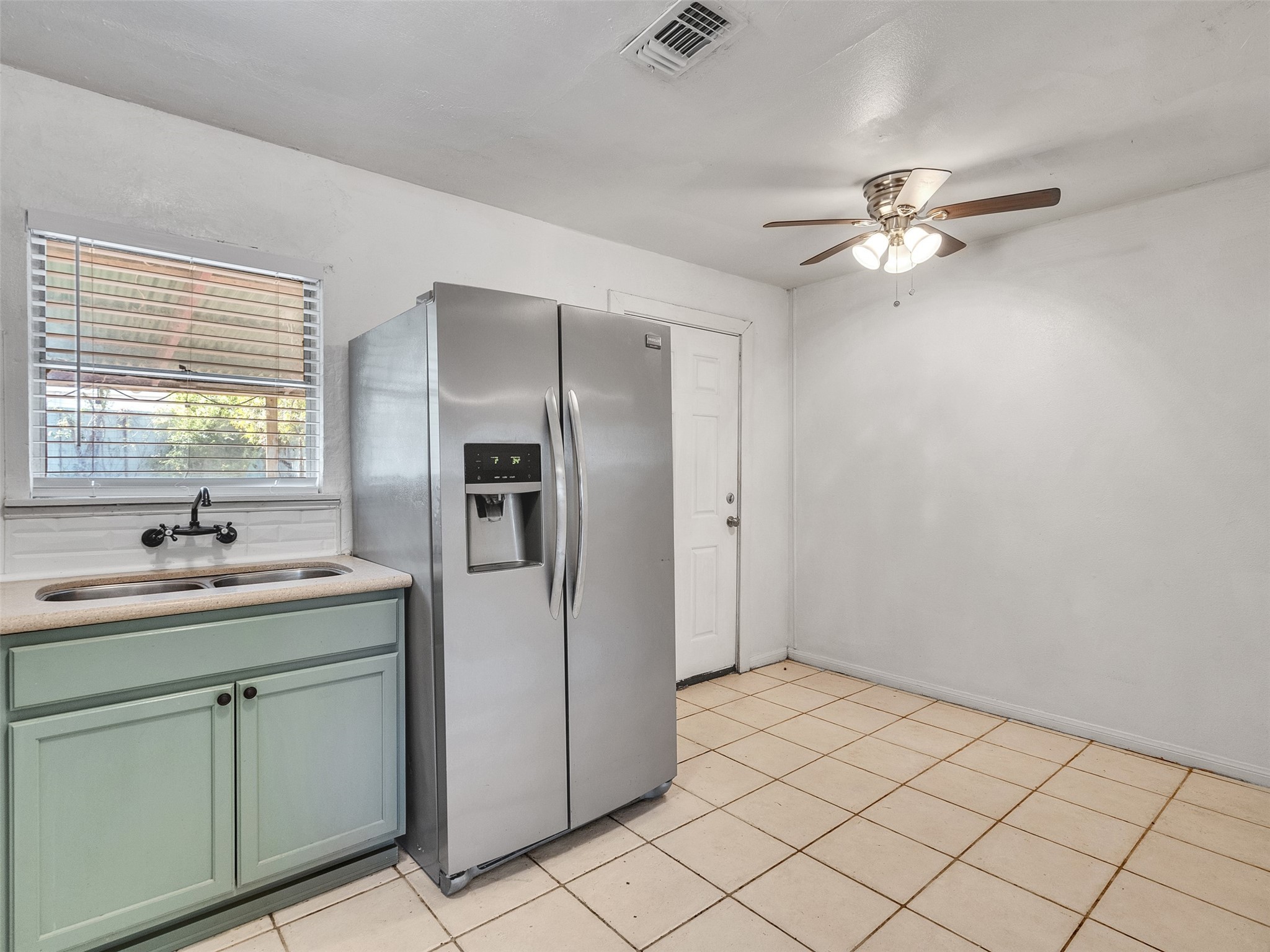 6942 Peyton Street Houston, TX 77028 - Photo 18 of 33 a kitchen with a sink appliances and cabinets
