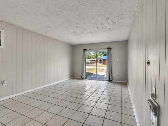 a view of an empty room and a window