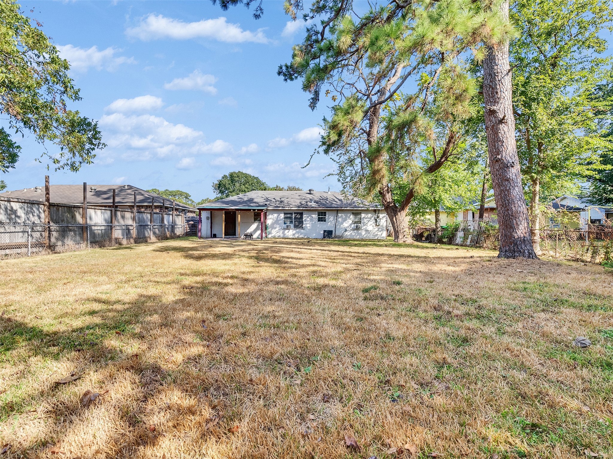 6942 Peyton Street Houston, TX 77028 - Photo 27 of 33 a view of a house with a yard