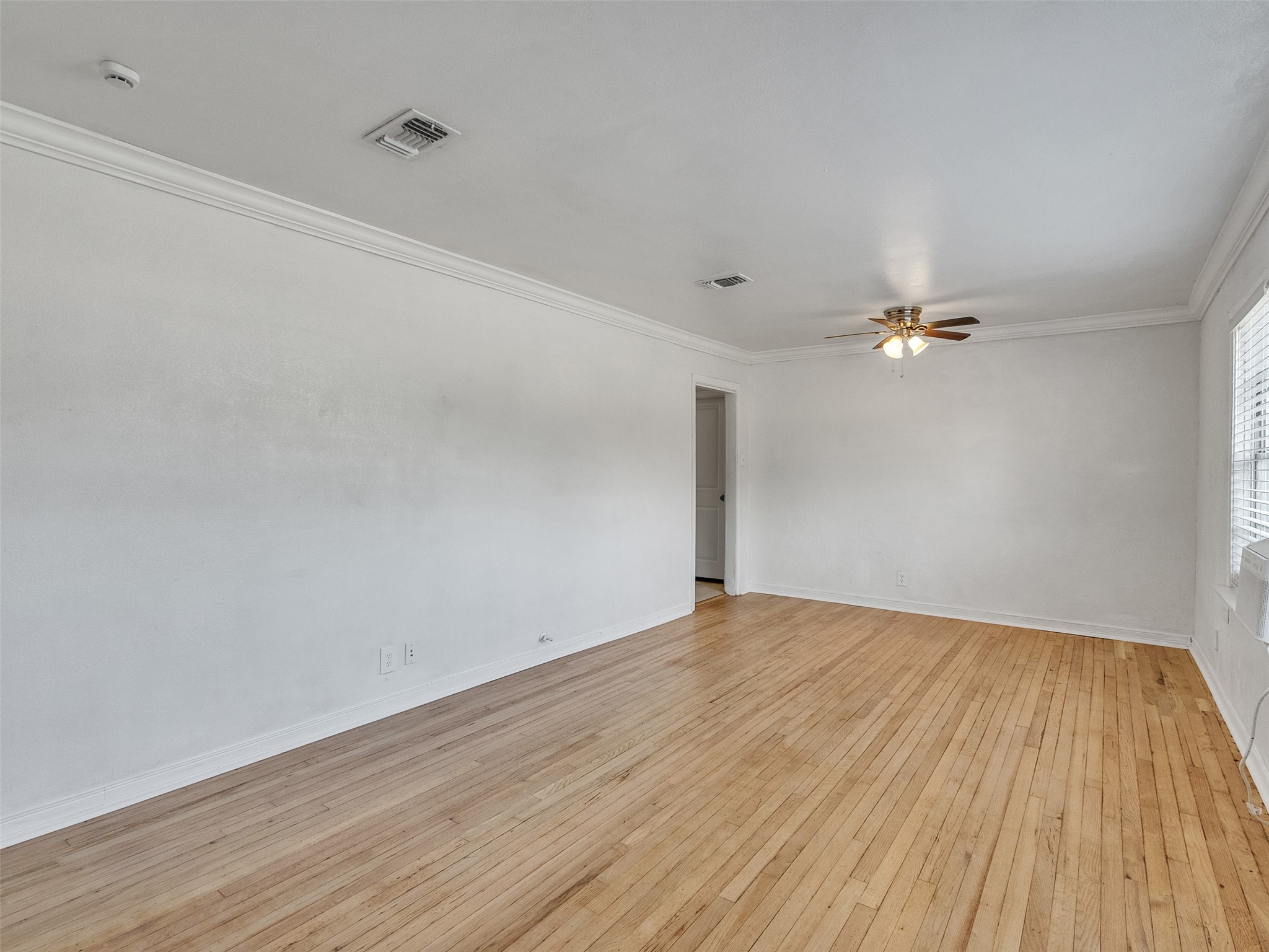 6942 Peyton Street Houston, TX 77028 - Photo 8 of 33 wooden floor in an empty room