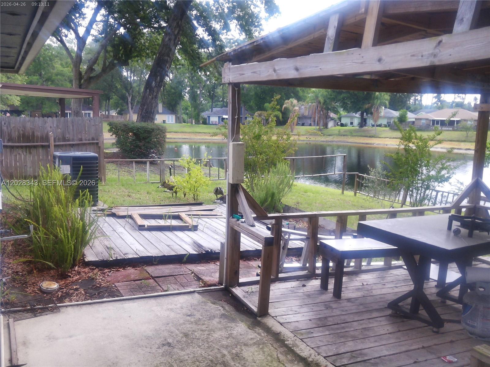 1641 Spring Oaks Lane Jacksonville, FL 32221 - Photo 39 of 44 a view of a chairs and table in patio with a fire pit