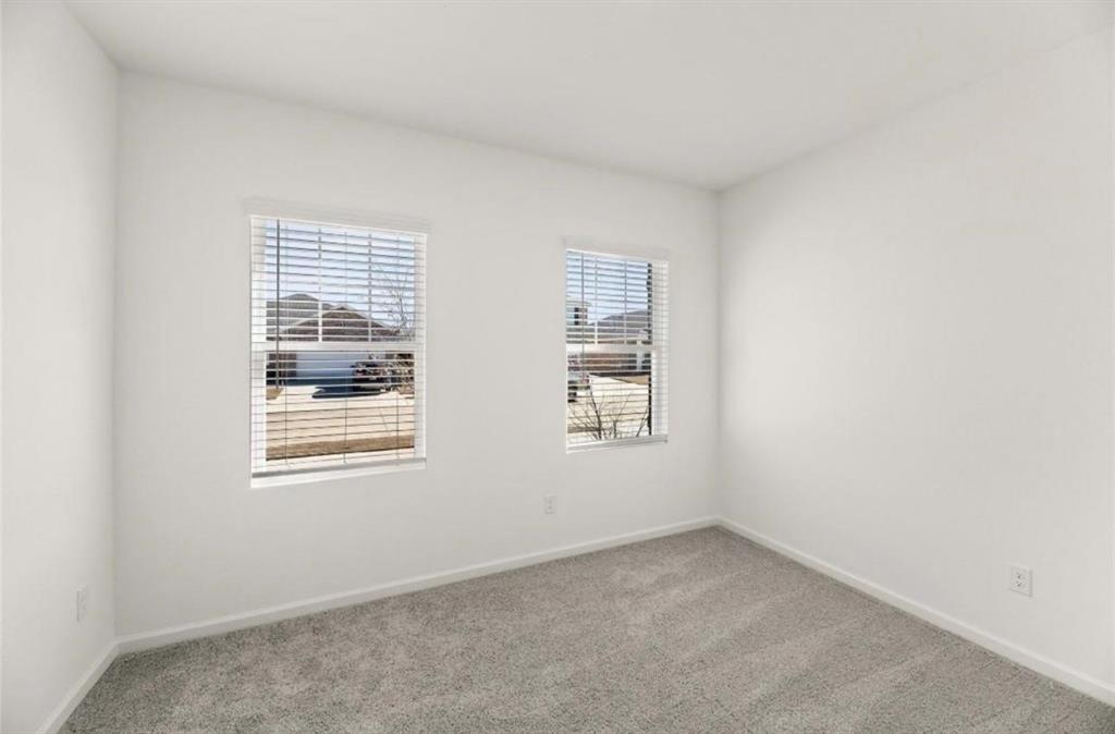 10308 Holy Cross Lane Crowley, TX 76036 - Photo 5 of 27 an empty room with windows