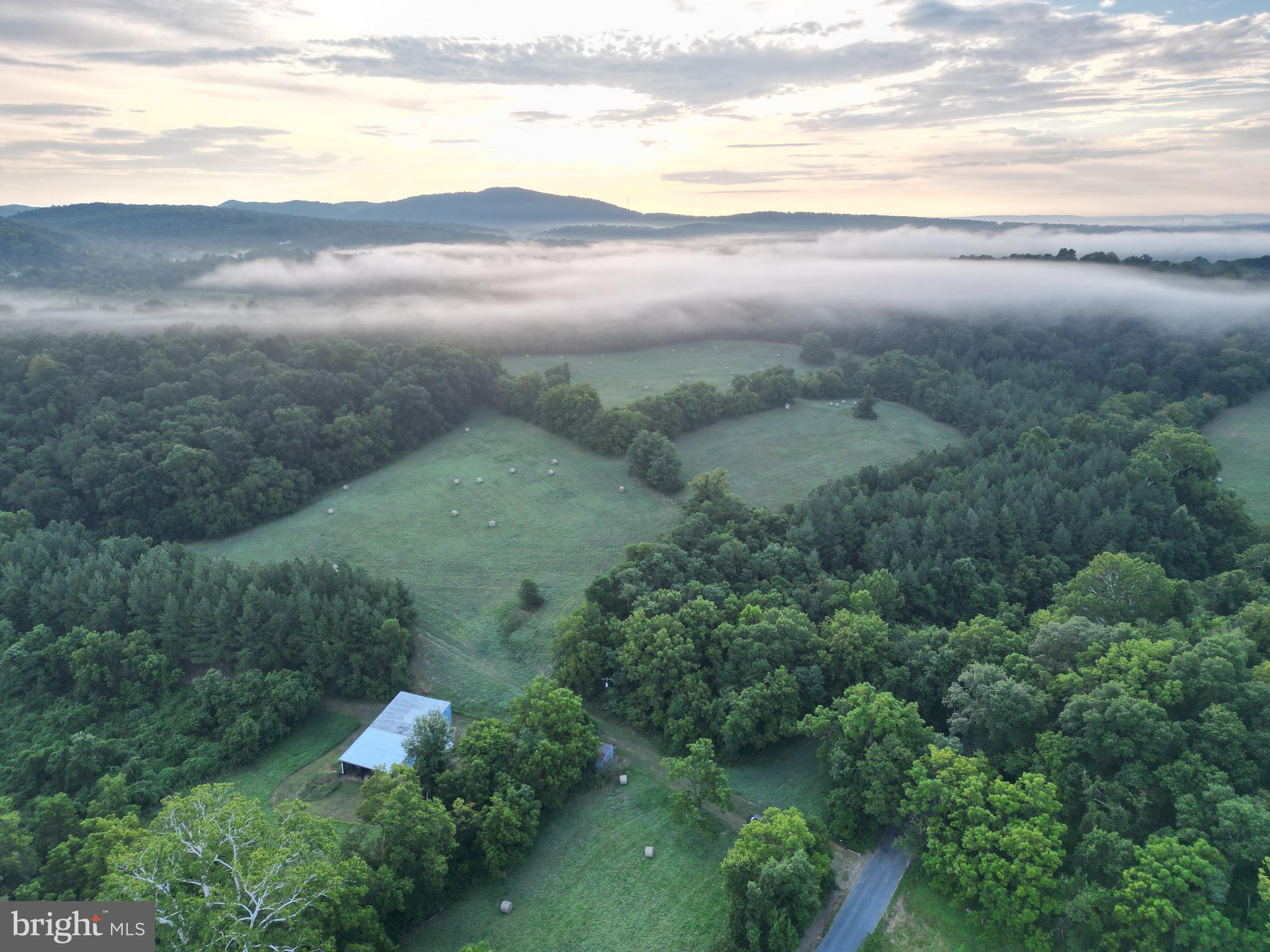 2251 Householder Road Hedgesville, WV 25427 - Photo 2 of 65 a view of a lake with a mountain in the background
