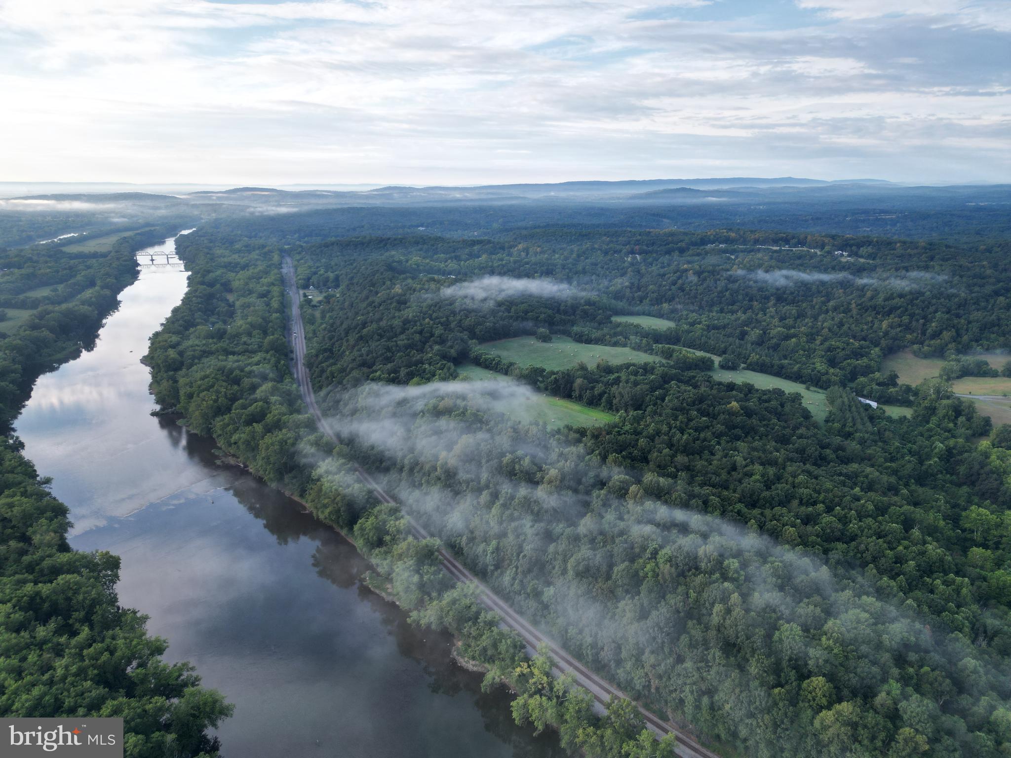 2251 Householder Road Hedgesville, WV 25427 - Photo 2 of 65 a view of a yard with an ocean and trees