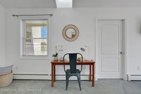 a view of a livingroom with furniture and window
