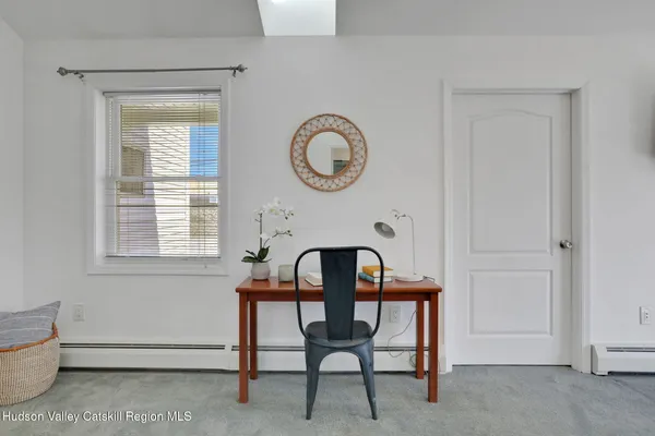 a view of a livingroom with furniture and window