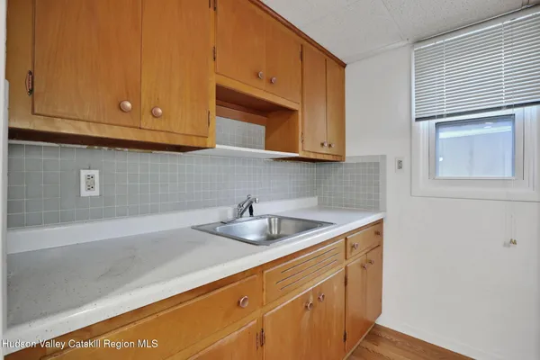 a kitchen with a sink and cabinets