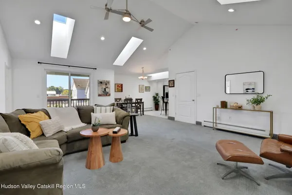 a living room with furniture and a chair