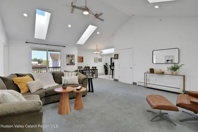 a living room with furniture and a chair