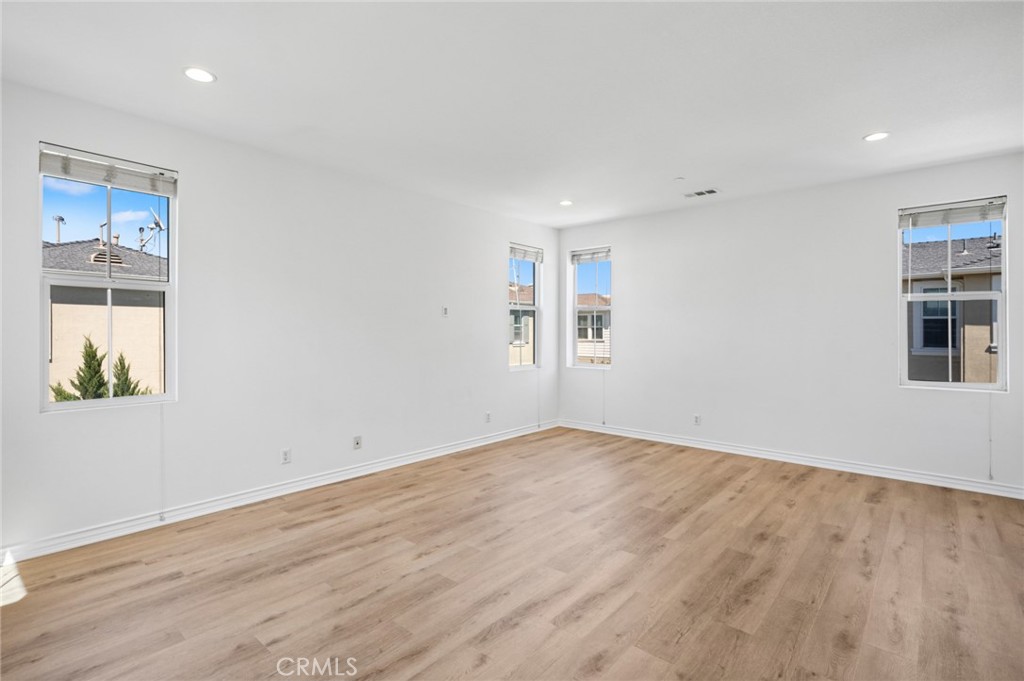56 Fringe Tree Irvine, CA 92606 - Photo 13 of 26 an empty room with windows
