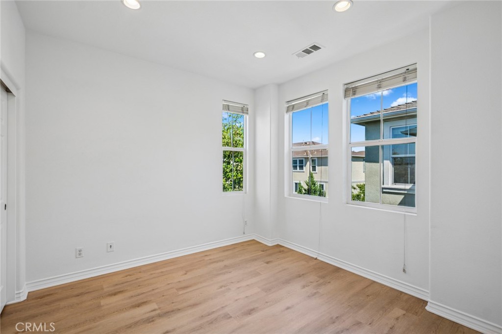 56 Fringe Tree Irvine, CA 92606 - Photo 17 of 26 an empty room with windows