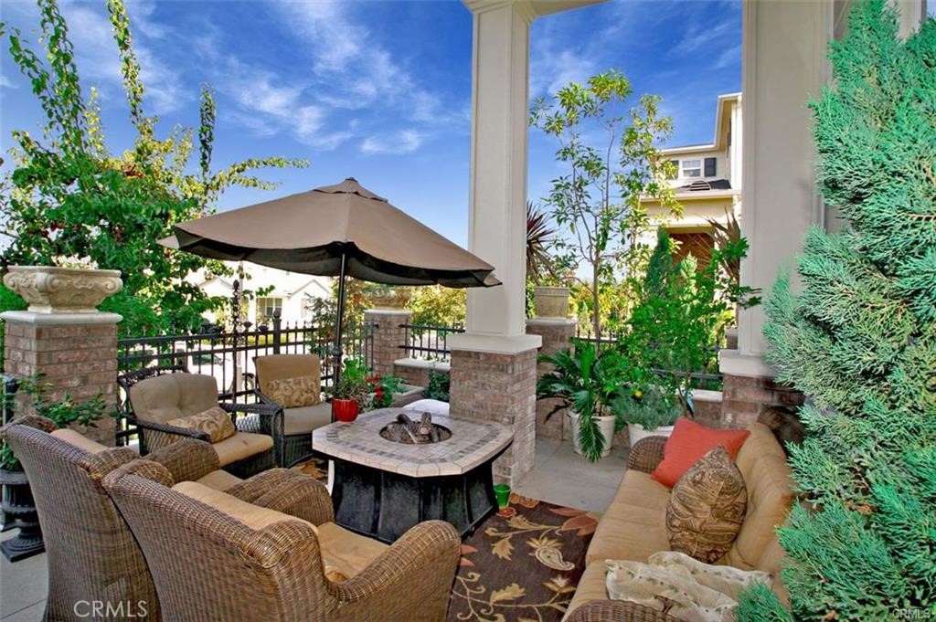 56 Fringe Tree Irvine, CA 92606 - Photo 2 of 26 a view of a backyard with furniture and a garden