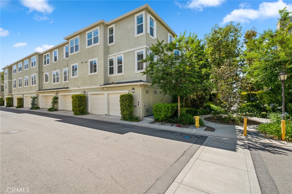 56 Fringe Tree Irvine, CA 92606 - Photo 21 of 26 a front view of a building with street view