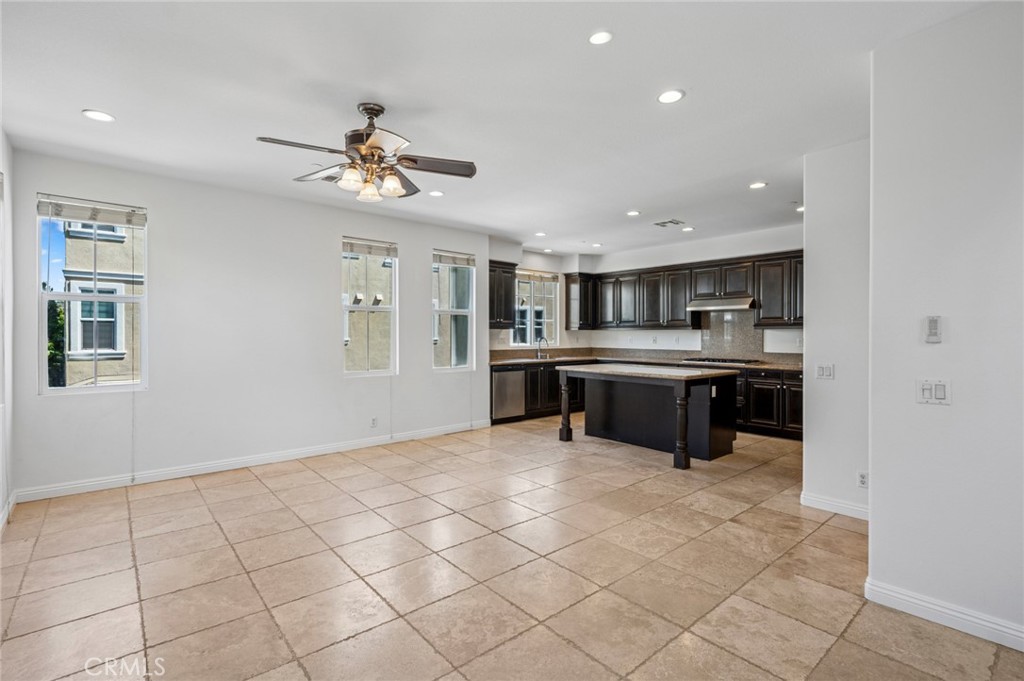 56 Fringe Tree Irvine, CA 92606 - Photo 8 of 26 a kitchen with stainless steel appliances granite countertop a sink counter top space cabinets and a window