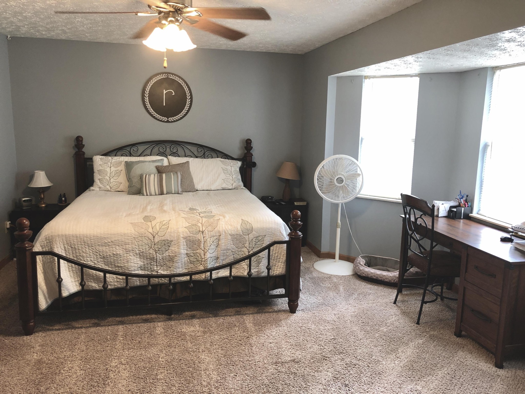 925 Tree Trunk Road Knoxville, TN 37934 - Photo 16 of 32 a bedroom with a bed and a chandelier