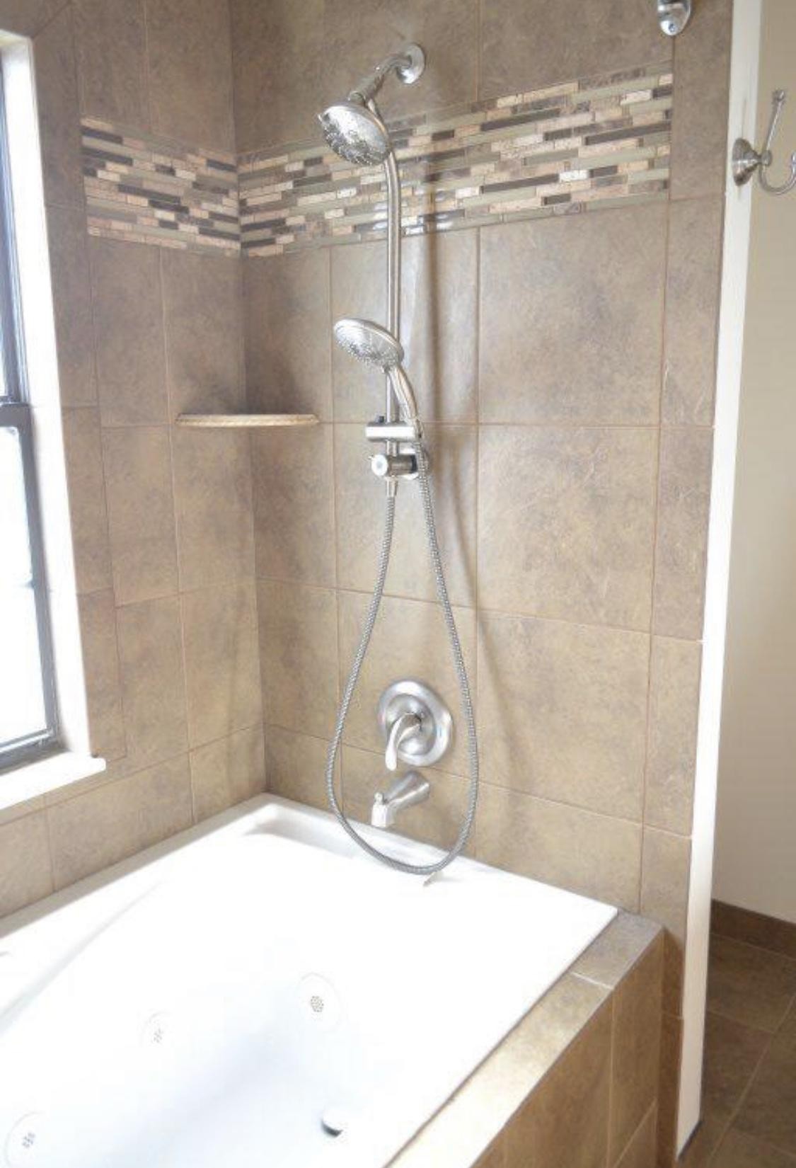 925 Tree Trunk Road Knoxville, TN 37934 - Photo 17 of 32 a bathroom with a granite countertop sink a toilet and a shower