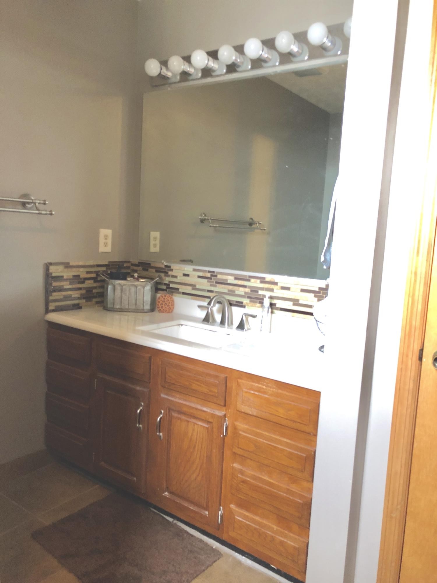 925 Tree Trunk Road Knoxville, TN 37934 - Photo 19 of 32 a bathroom with a sink vanity and mirror