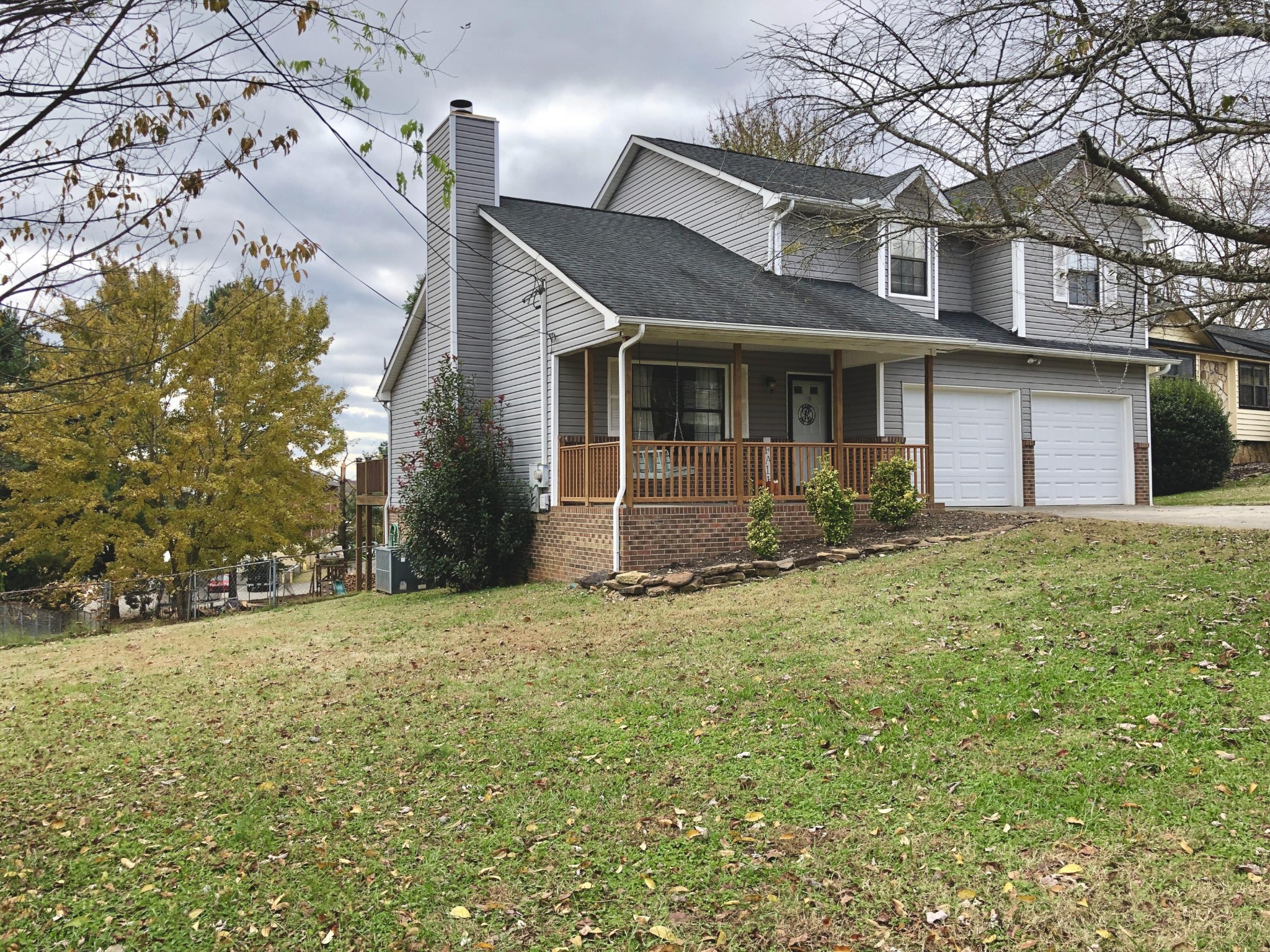 925 Tree Trunk Road Knoxville, TN 37934 - Photo 2 of 32 a front view of a house with a yard and garage