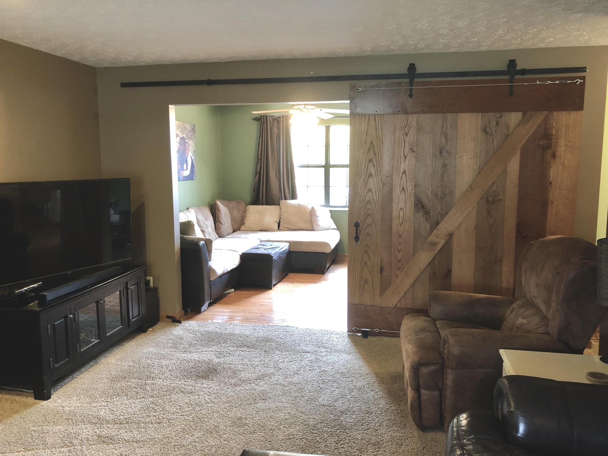 925 Tree Trunk Road Knoxville, TN 37934 - Photo 5 of 32 a bedroom with furniture and a flat screen tv