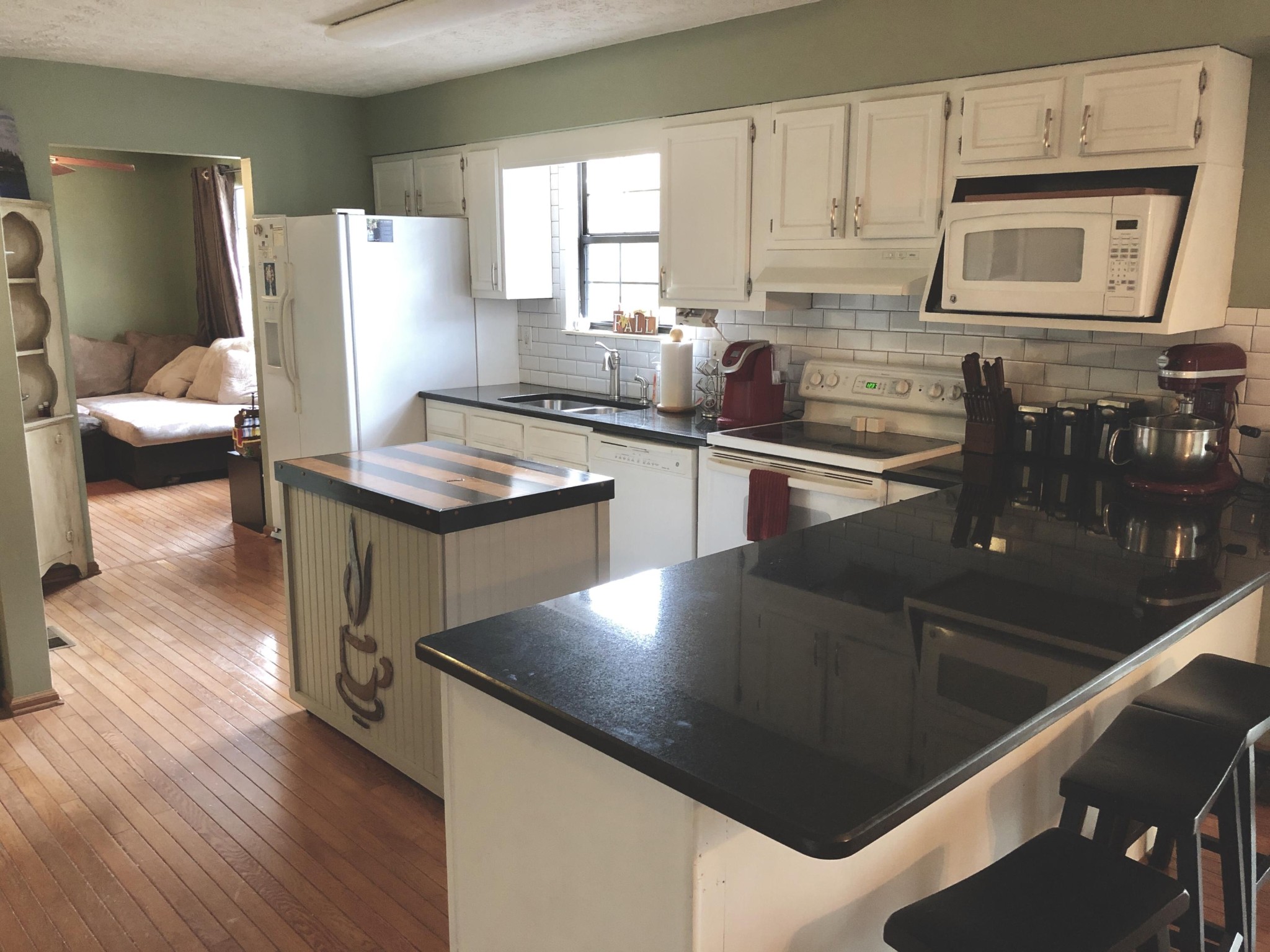 925 Tree Trunk Road Knoxville, TN 37934 - Photo 6 of 32 a kitchen with stainless steel appliances granite countertop a sink a stove counter space and cabinets