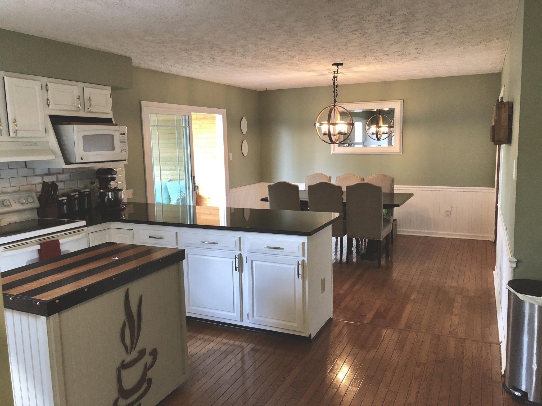 925 Tree Trunk Road Knoxville, TN 37934 - Photo 7 of 32 a kitchen with stainless steel appliances granite countertop a stove a sink and a refrigerator
