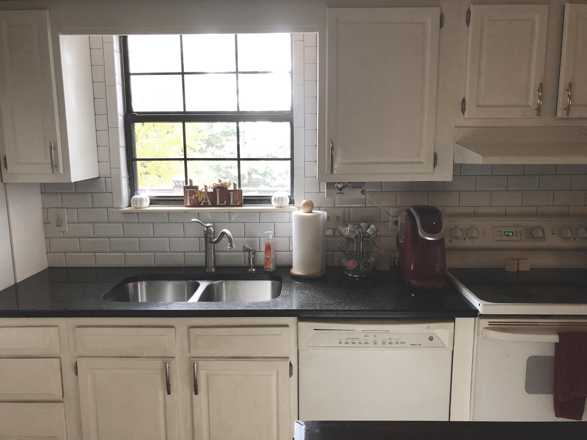 925 Tree Trunk Road Knoxville, TN 37934 - Photo 8 of 32 a kitchen with white cabinets and window