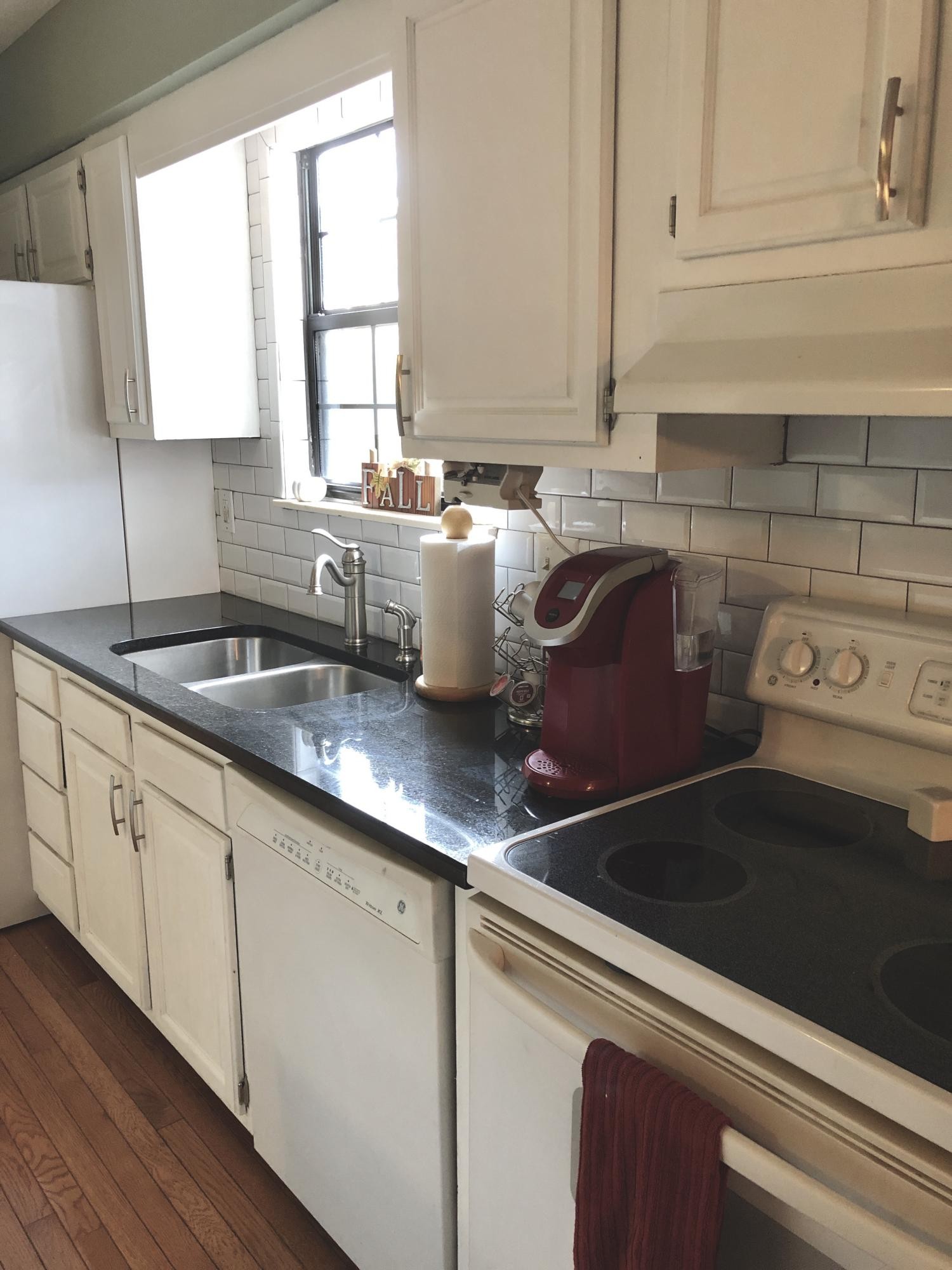 925 Tree Trunk Road Knoxville, TN 37934 - Photo 9 of 32 a kitchen with sink a microwave and cabinets