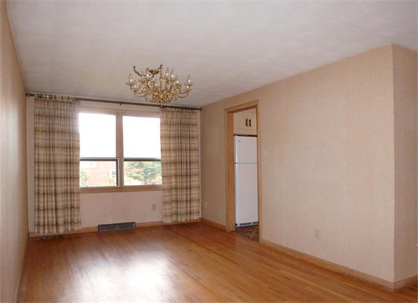 133 West Meadowview Road Holyoke, MA 01040 - Photo 6 of 29 an empty room with wooden floor and windows