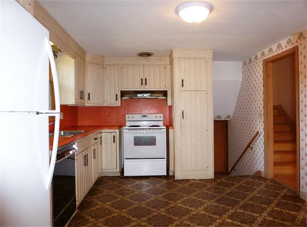 133 West Meadowview Road Holyoke, MA 01040 - Photo 7 of 29 a kitchen with white cabinets and white appliances