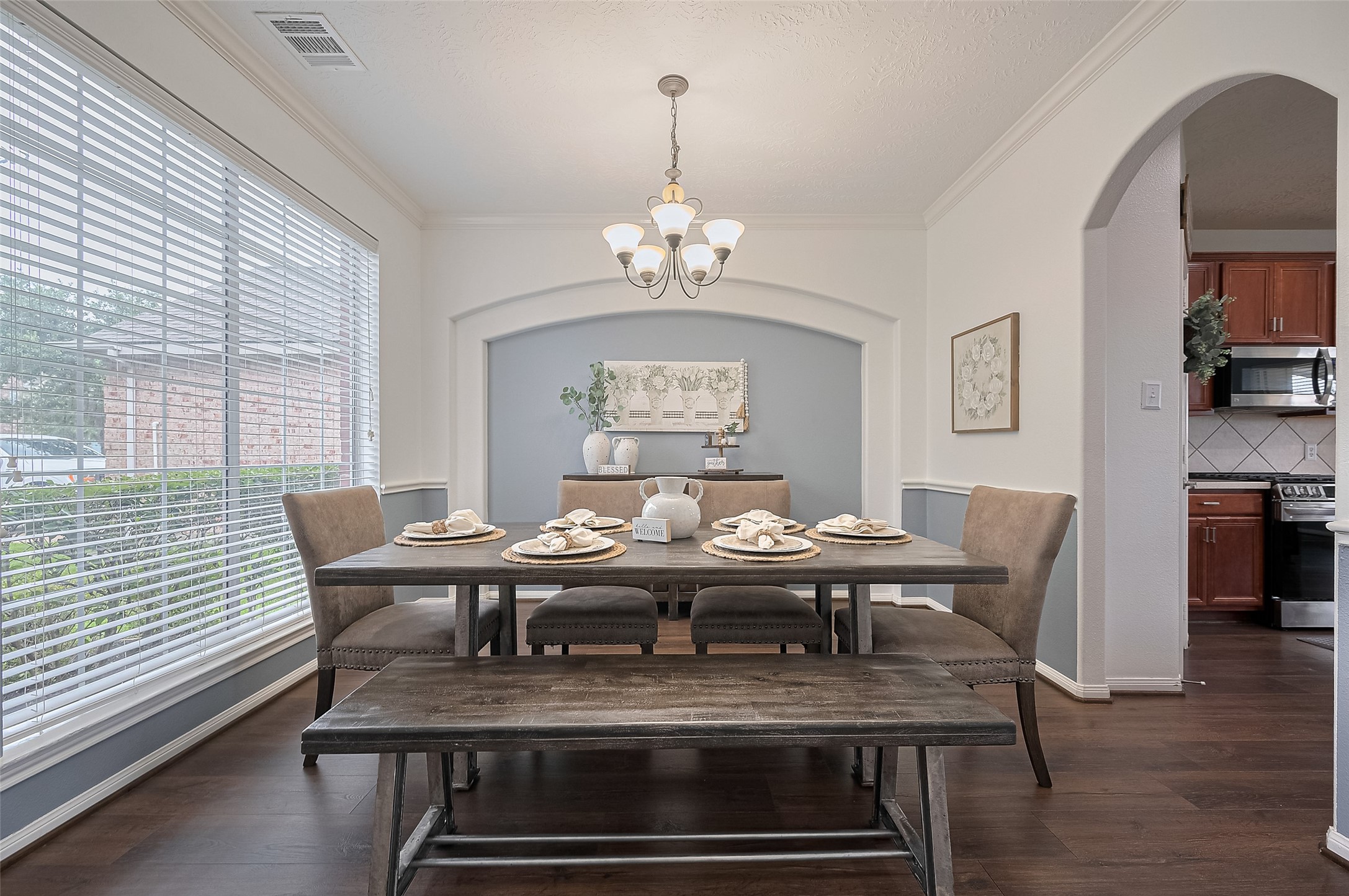 21506 Avalon Queen Drive Spring, TX 77379 - Photo 11 of 48 a view of a dining room with furniture a chandelier and wooden floor