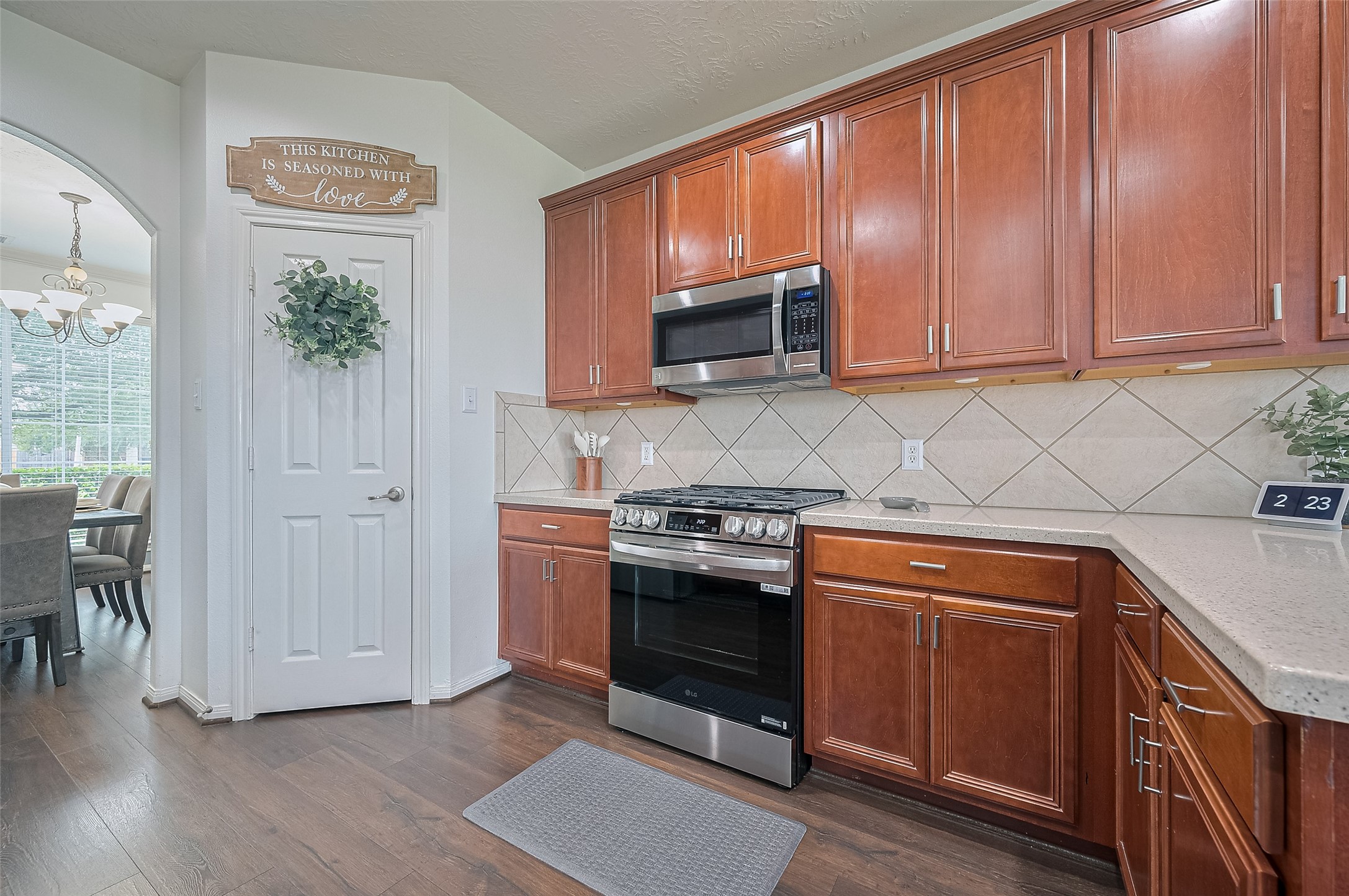 21506 Avalon Queen Drive Spring, TX 77379 - Photo 14 of 48 a kitchen with stainless steel appliances granite countertop a stove a sink and a microwave