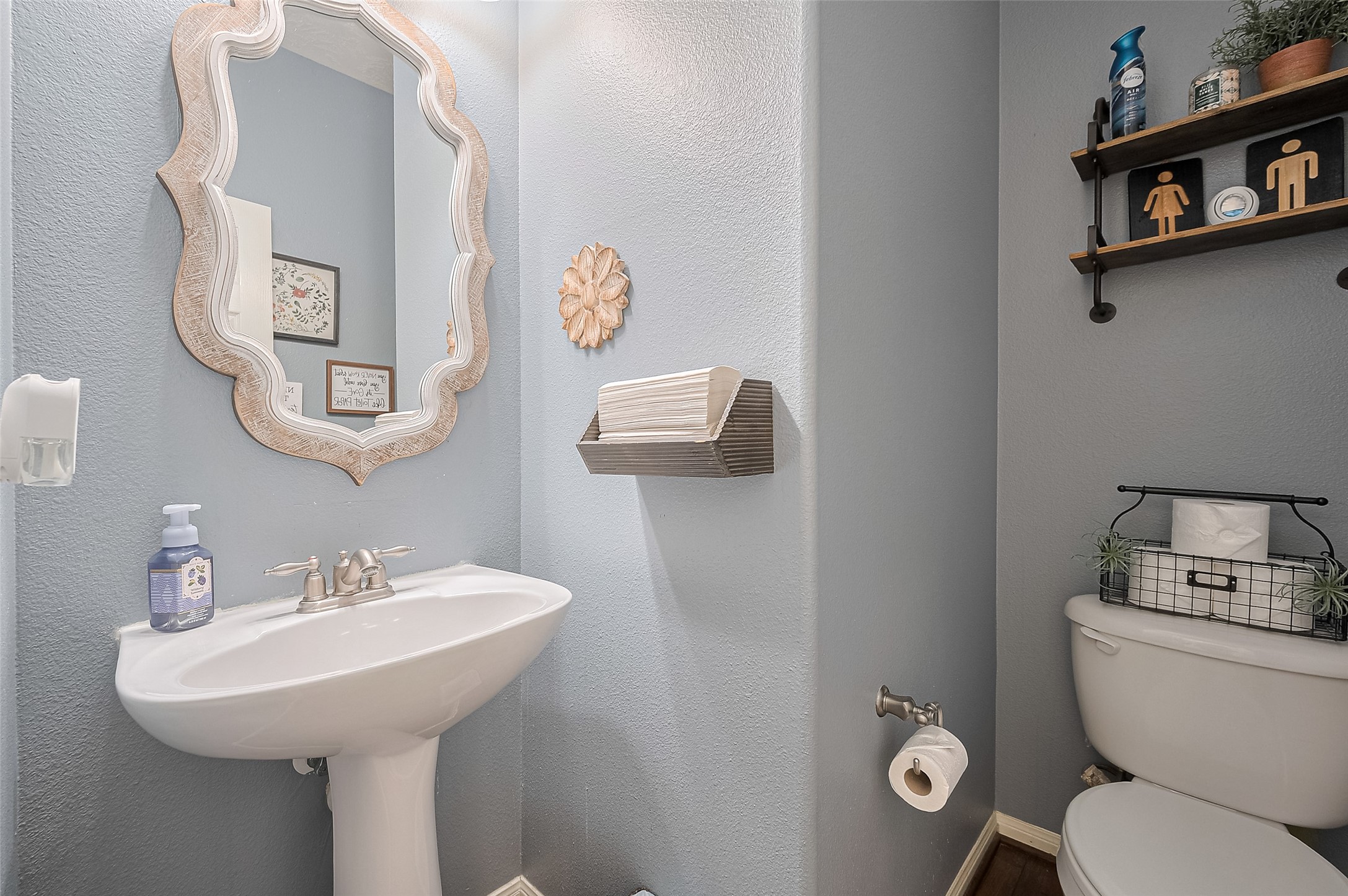 21506 Avalon Queen Drive Spring, TX 77379 - Photo 19 of 48 a bathroom with a toilet sink and mirror