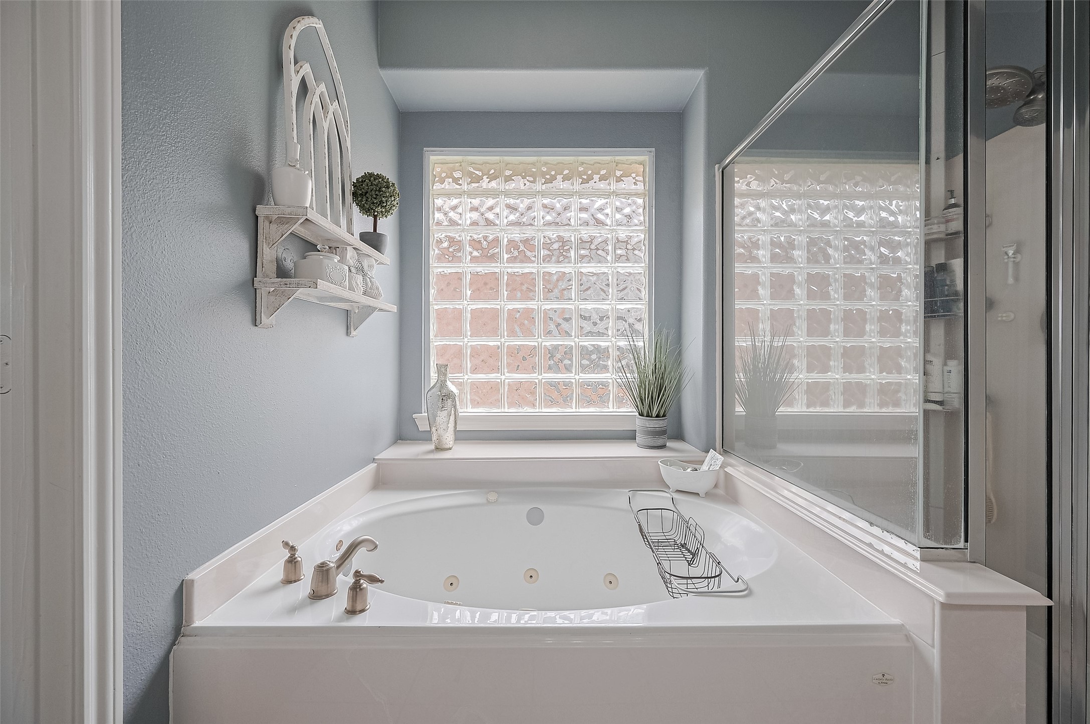21506 Avalon Queen Drive Spring, TX 77379 - Photo 26 of 48 a bathroom with a bathtub and a shower