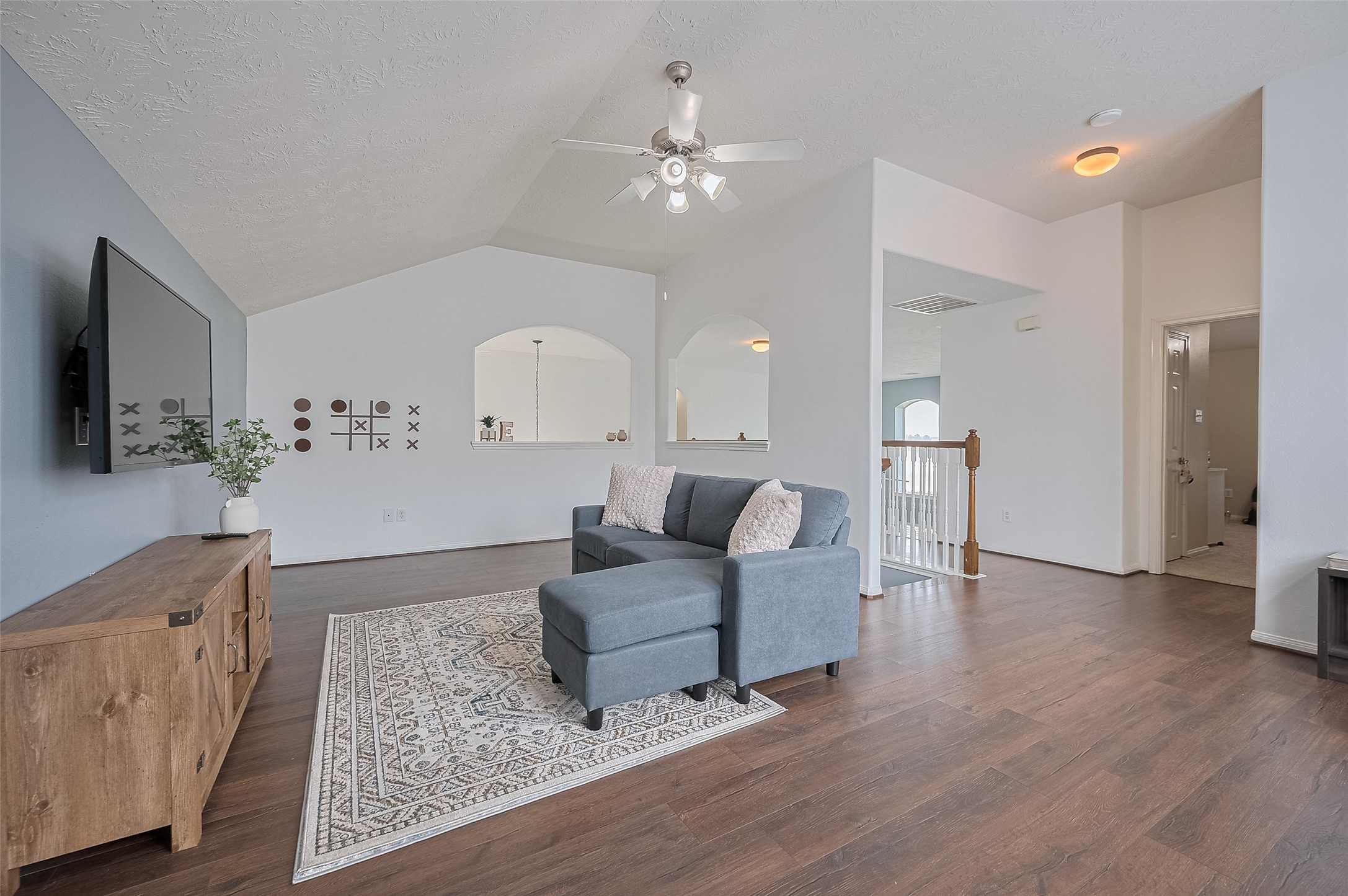 21506 Avalon Queen Drive Spring, TX 77379 - Photo 31 of 48 a living room with furniture and a chandelier